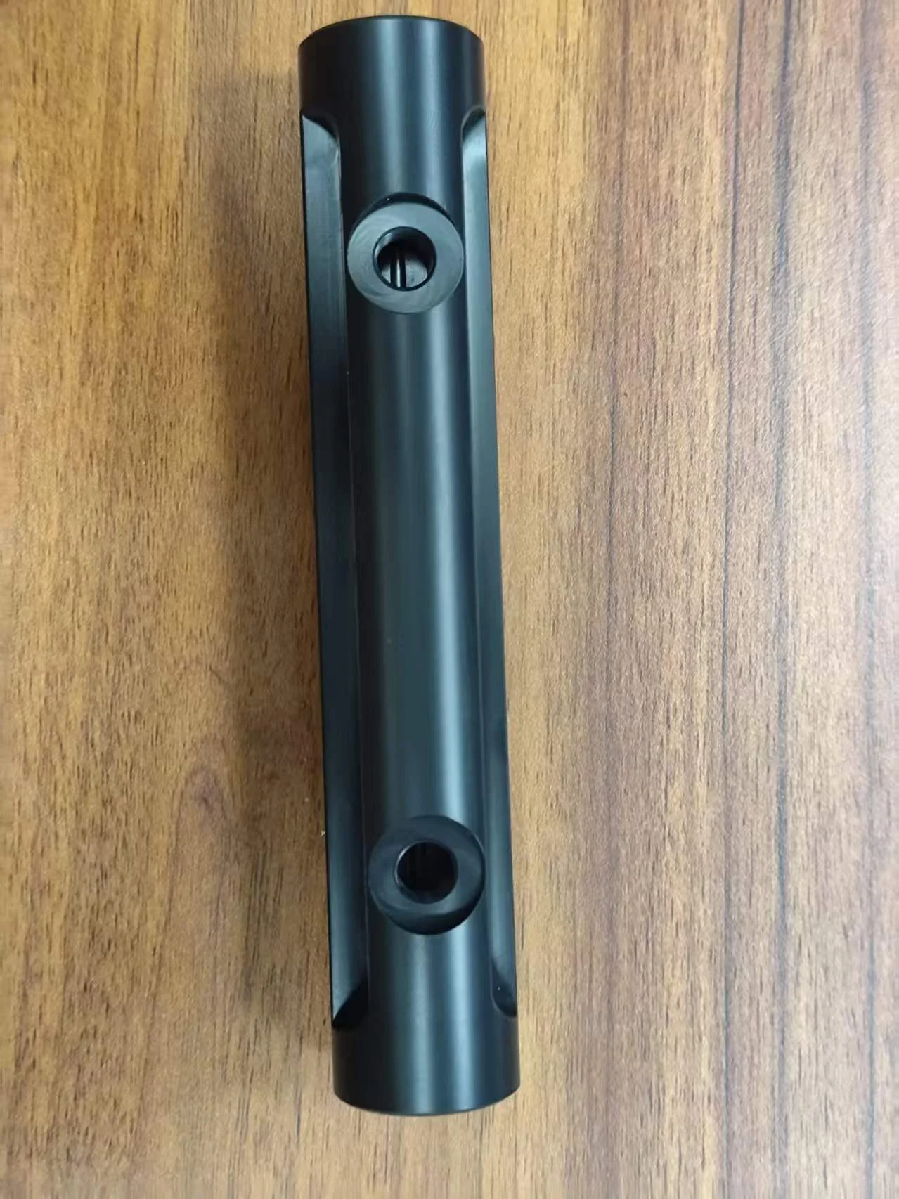 Turn-milled cylindrical component with cross holes and longitudinal side features